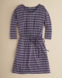 A bold stripe and braided belt accent this simple dress. A bold stripe and braided belt accent this simple dress.