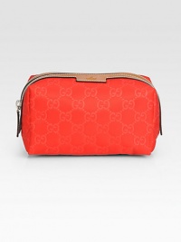 Nylon Guccissima trimmed with leather in a petite zip-top case.Top zip closureFully lined6¼W X 3½H X 3½DMade in Italy Nylon Guccissima trimmed with leather in a petite zip-top case.Top zip closureFully lined6¼W X 3½H X 3½DMade in Italy