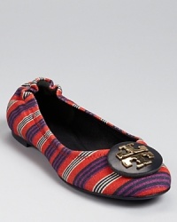 Reimagined in a colorful stripe-printed canvas, the Reva flat gets a patterned makeover. From Tory Burch. Reimagined in a colorful stripe-printed canvas, the Reva flat gets a patterned makeover. From Tory Burch.