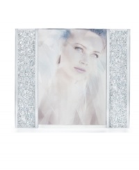 Make your memories shine even brighter with the Starlet picture frame. Sparkling Swarovski crystals along the frame's edges, surround your photo for a sophisticated sensibility. Make your memories shine even brighter with the Starlet picture frame. Sparkling Swarovski crystals along the frame's edges, surround your photo for a sophisticated sensibility.