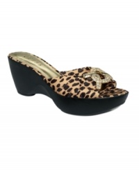 Va-va-voom in a flash, by GUESS. The Radwa sandals create a party with their flirty finishes and trendy wedge heels. Va-va-voom in a flash, by GUESS. The Radwa sandals create a party with their flirty finishes and trendy wedge heels.