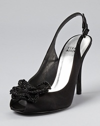 A beaded mesh flower exudes understanded glam on Stuart Weitzman's Superbow slingbacks. Pair them with a dazzling clutch for sophisticated evening style. A beaded mesh flower exudes understanded glam on Stuart Weitzman's Superbow slingbacks. Pair them with a dazzling clutch for sophisticated evening style.