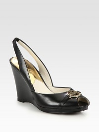 Sleek and comfortable peep toe design of rich leather with an elevated wedge, signature metal logo and elastic slingback. Stacked heel, 3¾ (95mm)Leather upperPeep toeLeather lining and solePadded insoleImported Sleek and comfortable peep toe design of rich leather with an elevated wedge, signature metal logo and elastic slingback. Stacked heel, 3¾ (95mm)Leather upperPeep toeLeather lining and solePadded insoleImported