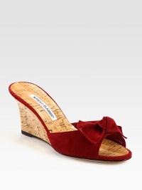 Natural cork wedge with a suede upper and bow adornment. Cork-covered wedge, 2¾ (70mm)Suede and natural cork upperBuffed leather soleMade in ItalyOUR FIT MODEL RECOMMENDS ordering one half size up as this style runs small. 