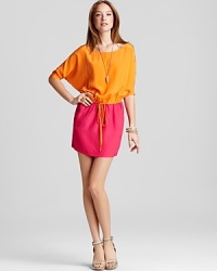 Juicy hues add a bold kick to this dolman sleeve Twelfth Street by Cynthia Vincent dress. Add a gold pendant and an armful of bangles for cocktail-ready style. Juicy hues add a bold kick to this dolman sleeve Twelfth Street by Cynthia Vincent dress. Add a gold pendant and an armful of bangles for cocktail-ready style.