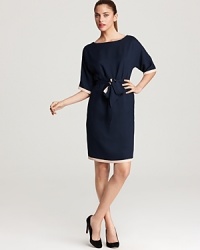 A modern take on the classic sheath, this navy MARC BY MARC JACOBS dress features tan trim, dolman sleeves and a fabric belt to flaunt your feminine figure. A modern take on the classic sheath, this navy MARC BY MARC JACOBS dress features tan trim, dolman sleeves and a fabric belt to flaunt your feminine figure.