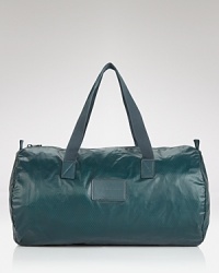 Stash your weekend essentials in this sporty and stylish rubber duffel and head for the train station. It's gonna be a great trip. Stash your weekend essentials in this sporty and stylish rubber duffel and head for the train station. It's gonna be a great trip.