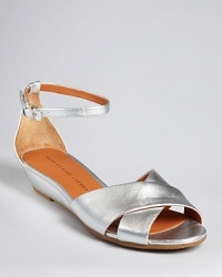 Streamlined sophistication takes flight in these gleaming MARC BY MARC JACOBS demi wedge sandals, flatly fantastic and ready for full-speed-ahead-yet-stylish adventures. Streamlined sophistication takes flight in these gleaming MARC BY MARC JACOBS demi wedge sandals, flatly fantastic and ready for full-speed-ahead-yet-stylish adventures.