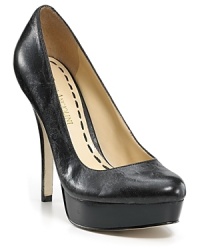 Lightly distressed leather lends an edgy feel to a classic platform pump from Enzo Angiolini. Lightly distressed leather lends an edgy feel to a classic platform pump from Enzo Angiolini.