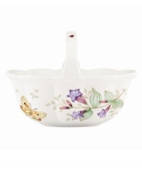Spring is perpetually in season with the whimsical Butterfly Meadow basket from Lenox. A handled design with colorful blooms and butterflies in scalloped white porcelain lends country charm to any setting. Spring is perpetually in season with the whimsical Butterfly Meadow basket from Lenox. A handled design with colorful blooms and butterflies in scalloped white porcelain lends country charm to any setting.