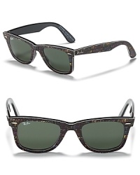 Talk that talk without saying a word. These Ray-Ban wayfarers have a fashion-forward frames dappled with text. Talk that talk without saying a word. These Ray-Ban wayfarers have a fashion-forward frames dappled with text.