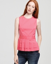 Classic pleats and an on-trend peplum waist catapult this pretty, polished Theory top to a new stratosphere of chic. Classic pleats and an on-trend peplum waist catapult this pretty, polished Theory top to a new stratosphere of chic.