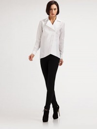 The classic cotton shirt gets a modern update with an edgy, asymmetrical cut.Notched lapelsBreast patch pocketAsymmetrical button frontAsymmetrical hemlineLong sleeves with button cuffsSide ventsSignature back loop detailAbout 25 from shoulder to hemCottonDry cleanMade in ItalyModel shown is 5'10 (177cm) wearing US size 4. The classic cotton shirt gets a modern update with an edgy, asymmetrical cut.Notched lapelsBreast patch pocketAsymmetrical button frontAsymmetrical hemlineLong sleeves with button cuffsSide ventsSignature back loop detailAbout 25 from shoulder to hemCottonDry cleanMade in ItalyModel shown is 5'10 (177cm) wearing US size 4.