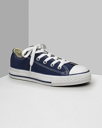 Low cut Converse All Stars. This classic canvas sneaker set the standard in cool and comfort. Available in kids sizes. With lace-up canvas uppers, contrast stitching and rubber sole and toe. Low cut Converse All Stars. This classic canvas sneaker set the standard in cool and comfort. Available in kids sizes. With lace-up canvas uppers, contrast stitching and rubber sole and toe.
