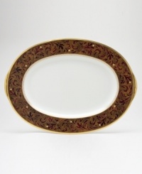 Add drama to your tabletop with this bold pattern from Noritake! Strikingly elegant, this bone china features a rich gold and red brocade border adorned with soft ivory dots and a gold band. Add drama to your tabletop with this bold pattern from Noritake! Strikingly elegant, this bone china features a rich gold and red brocade border adorned with soft ivory dots and a gold band.