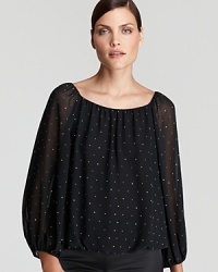 Gold-tone rhinestones punctuate the clean silhouette of this VINCE CAMUTO blouse for a polished office essential with touch of punk. Gold-tone rhinestones punctuate the clean silhouette of this VINCE CAMUTO blouse for a polished office essential with touch of punk.