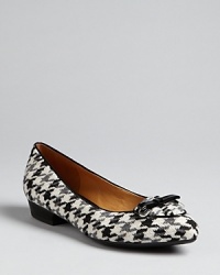 Patent piping pops against natty houndstooth in these Isaac Mizrahi flats, featuring this season's must-have pointed toe silhouette. They're perfect, workday or weekend. Patent piping pops against natty houndstooth in these Isaac Mizrahi flats, featuring this season's must-have pointed toe silhouette. They're perfect, workday or weekend.