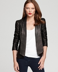 A sharp asymmetric hemline is eye-catching on this Rebecca Minkoff leather blazer, replete with puff shoulders and pleating at the elbows. A finishing touch for your cocktail silhouettes, this forward style lends modern edge to the most classic looks. A sharp asymmetric hemline is eye-catching on this Rebecca Minkoff leather blazer, replete with puff shoulders and pleating at the elbows. A finishing touch for your cocktail silhouettes, this forward style lends modern edge to the most classic looks.