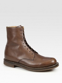 Brown leather lace-up with side zip closure.Embossed Gucci script logo at sideRubber/cork lug sole with contrast stitching and interlocking G detailMade in Italy Brown leather lace-up with side zip closure.Embossed Gucci script logo at sideRubber/cork lug sole with contrast stitching and interlocking G detailMade in Italy