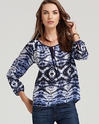 A tie-dye print lends eclectic attitude to this bohemian-chic Velvet by Graham & Spencer top. A tie-dye print lends eclectic attitude to this bohemian-chic Velvet by Graham & Spencer top.