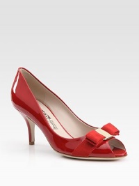 Delicate bow graces the front of this vibrant patent leather peep toe. Self-covered heel, 3 (75mm)Patent leather upperLeather lining and solePadded insoleMade in ItalyOUR FIT MODEL RECOMMENDS ordering true size. Delicate bow graces the front of this vibrant patent leather peep toe. Self-covered heel, 3 (75mm)Patent leather upperLeather lining and solePadded insoleMade in ItalyOUR FIT MODEL RECOMMENDS ordering true size.