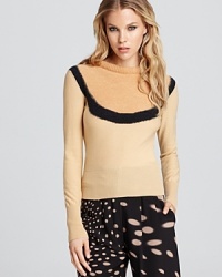 A Sonia Rykiel color block sweater is effortlessly cool for fall with a rolled neckline and raw-edge seams for modern detail. A Sonia Rykiel color block sweater is effortlessly cool for fall with a rolled neckline and raw-edge seams for modern detail.