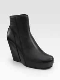 Sleek leather wedge with an urban-cool covered platform and convenient side zipper. Self-covered wedge, 4 (100mm)Covered platform, 1 (25mm)Compares to a 3 heel (75mm)Leather upperSide zipperLeather lining and solePadded insoleMade in Italy Sleek leather wedge with an urban-cool covered platform and convenient side zipper. Self-covered wedge, 4 (100mm)Covered platform, 1 (25mm)Compares to a 3 heel (75mm)Leather upperSide zipperLeather lining and solePadded insoleMade in Italy