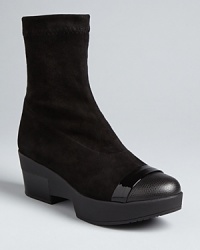 Robert Clergerie's brand is about fashion that stays functional; these booties stay true to that message, with low wedge heels and stretch uppers for the perfect fit, finished off with stylish cap toes. Robert Clergerie's brand is about fashion that stays functional; these booties stay true to that message, with low wedge heels and stretch uppers for the perfect fit, finished off with stylish cap toes.