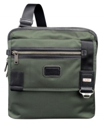 This slim cross body style works for travel or everyday use. It offers a secure top zip closure, front flap pocket and an adjustable shoulder strap. This slim cross body style works for travel or everyday use. It offers a secure top zip closure, front flap pocket and an adjustable shoulder strap.
