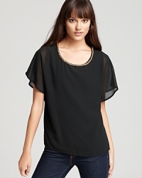 Leave your necklace at home tonight. Gold chain link details add subtle glamour to this whisper-light GUESS top we adore. Leave your necklace at home tonight. Gold chain link details add subtle glamour to this whisper-light GUESS top we adore.