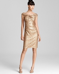 A knotted waist lends a modern touch to David Meister's shimmering sequin dress. A knotted waist lends a modern touch to David Meister's shimmering sequin dress.
