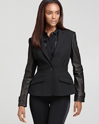 This Burberry London blazer is one part sophisticated, one part rocker chic thanks to the unexpected sleek leather sleeves. This Burberry London blazer is one part sophisticated, one part rocker chic thanks to the unexpected sleek leather sleeves.