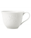 An elegant white-on-white pattern featuring an embossed vine motif and interior glaze lends this Opal Innocence Carved cup to refined dining every day.