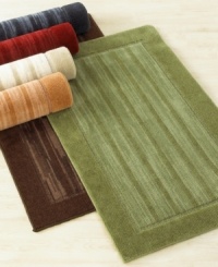 Offering timeless sophistication, this framed-stripe rug is available in six rich hues to complement any home décor. This handsome rug also features a stic-tite latex backing to stay in place at all times. Offering timeless sophistication, this framed-stripe rug is available in six rich hues to complement any home décor. This handsome rug also features a stic-tite latex backing to stay in place at all times.