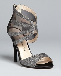 These runway-ready Caparros evening sandals-slash-booties are the perfect fashion-forward finish for your next big night out. Look like a million bucks. These runway-ready Caparros evening sandals-slash-booties are the perfect fashion-forward finish for your next big night out. Look like a million bucks.