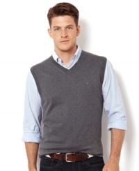 A simple layer like this sweater vest from Nautica adds some preppy polish to any look. A simple layer like this sweater vest from Nautica adds some preppy polish to any look.
