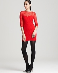 Heart rates will soar the moment you enter the party in this captivating lace Trina Turk dress.