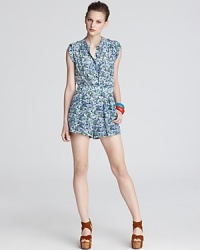 A dainty floral print brings feminine charm to this Shoshanna romper, a must-have spring/summer statement piece. A dainty floral print brings feminine charm to this Shoshanna romper, a must-have spring/summer statement piece.