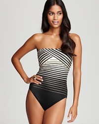 Optical stripes lend this Gottex bandeau swimsuit graphic, high-fashion appeal-but the best part is how incredibly flattering the pattern makes this must-have. Optical stripes lend this Gottex bandeau swimsuit graphic, high-fashion appeal-but the best part is how incredibly flattering the pattern makes this must-have.