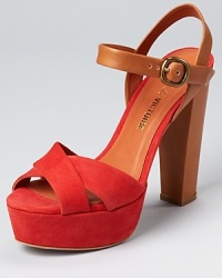 A color block design from Pour La Victoire is finished with a trend-right block heel and chunky platform, crafted in vibrant red suede and smooth saddle leather. A color block design from Pour La Victoire is finished with a trend-right block heel and chunky platform, crafted in vibrant red suede and smooth saddle leather.