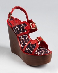Overflowing with unique details, the Tory Burch Florian wedges offer modern Americana. In patriotic red, white and blue, this standout shoe isn't afraid to show off its fashionable allegiances. Overflowing with unique details, the Tory Burch Florian wedges offer modern Americana. In patriotic red, white and blue, this standout shoe isn't afraid to show off its fashionable allegiances.