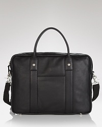 Transport your laptop to the office or cafe with this fine brief in pebbled leather, a classic design with masculine appeal from John Varvatos USA. Transport your laptop to the office or cafe with this fine brief in pebbled leather, a classic design with masculine appeal from John Varvatos USA.