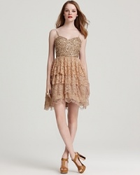 Achieve party perfection in this Aidan Mattox dress, featuring a sparkling sequin bodice atop a lace tiered skirt. Achieve party perfection in this Aidan Mattox dress, featuring a sparkling sequin bodice atop a lace tiered skirt.