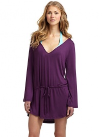 THE LOOKV-neckLong sleevesDropped waist with drawstring closureSide slits at hemTHE FITAbout 30 from shoulder to hemTHE MATERIAL95% rayon/5% spandexCARE & ORIGINHand washMade in USAModel shown is 5'10 (177cm) wearing US size Small. THE LOOKV-neckLong sleevesDropped waist with drawstring closureSide slits at hemTHE FITAbout 30 from shoulder to hemTHE MATERIAL95% rayon/5% spandexCARE & ORIGINHand washMade in USAModel shown is 5'10 (177cm) wearing US size Small.