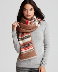 Reign in luxurious winter style with Juicy Couture's jacquard-knit scarf, woven with sparkly threads and multicolored wool. Reign in luxurious winter style with Juicy Couture's jacquard-knit scarf, woven with sparkly threads and multicolored wool.