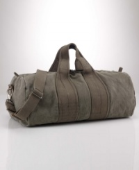 A heavy-duty, barrel-style canvas duffle is the perfect go-anywhere bag with its ability to stand up to the elements and maintain vintage style. A heavy-duty, barrel-style canvas duffle is the perfect go-anywhere bag with its ability to stand up to the elements and maintain vintage style.