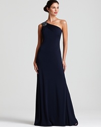 An opulently beaded shoulder lends a hint of sparkling glamour to this David Meister one-shoulder gown. An opulently beaded shoulder lends a hint of sparkling glamour to this David Meister one-shoulder gown.