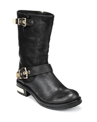 VINCE CAMUTO takes the moto boot gold in this polished pair featuring gilded buckles and logo plates: Well-heeled biker style. VINCE CAMUTO takes the moto boot gold in this polished pair featuring gilded buckles and logo plates: Well-heeled biker style.