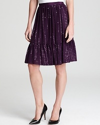 Ablaze with brilliant sequins, this DKNY skirt flaunts a flounced hemline for a style that moves vibrantly through your night. Ablaze with brilliant sequins, this DKNY skirt flaunts a flounced hemline for a style that moves vibrantly through your night.
