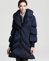 Fashion meets function with this Elie Tahari coat, ultra-warm and endlessly cool with trend-right features and plush down fill. Fashion meets function with this Elie Tahari coat, ultra-warm and endlessly cool with trend-right features and plush down fill.